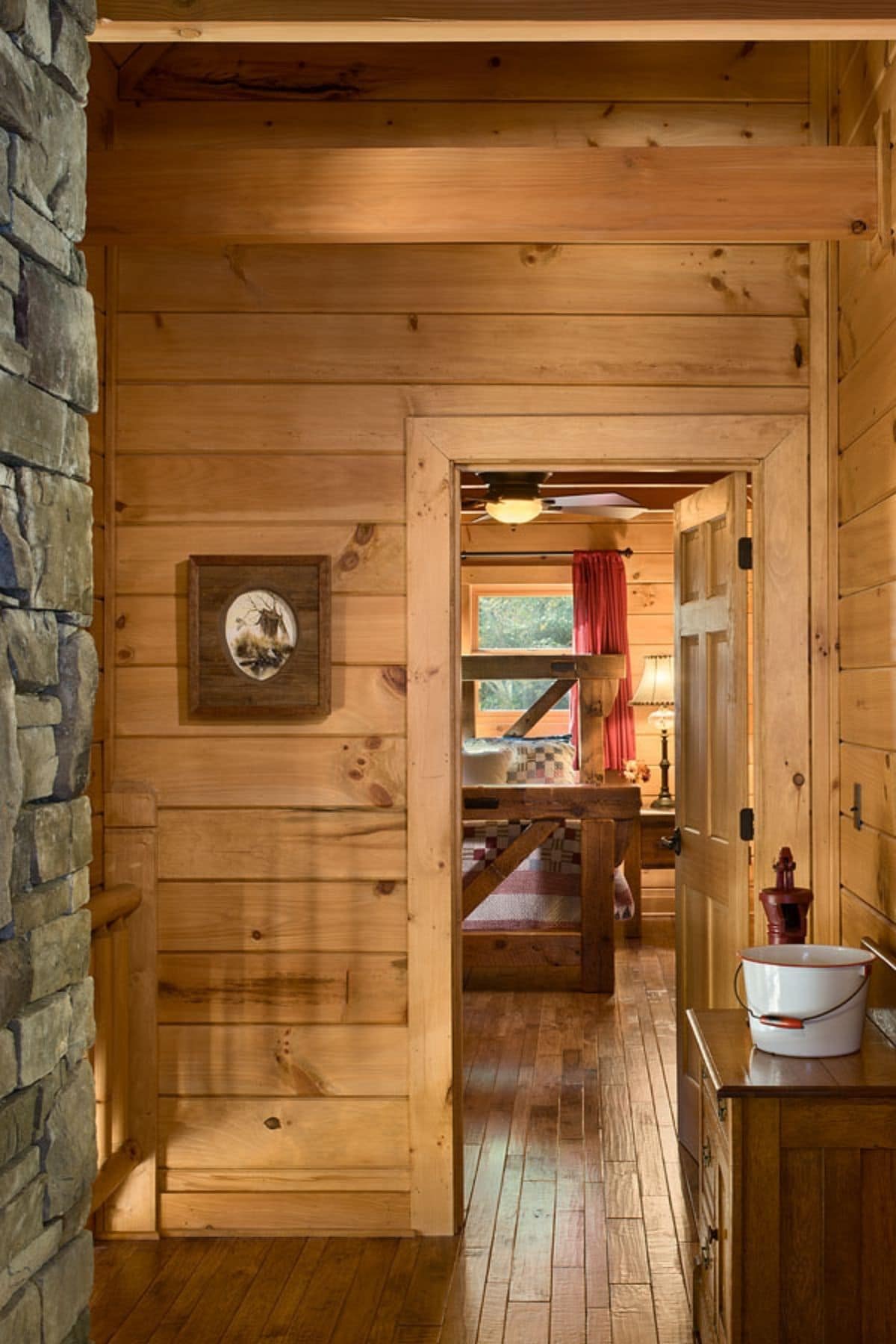 bathroom with stone wall on left and sink on right