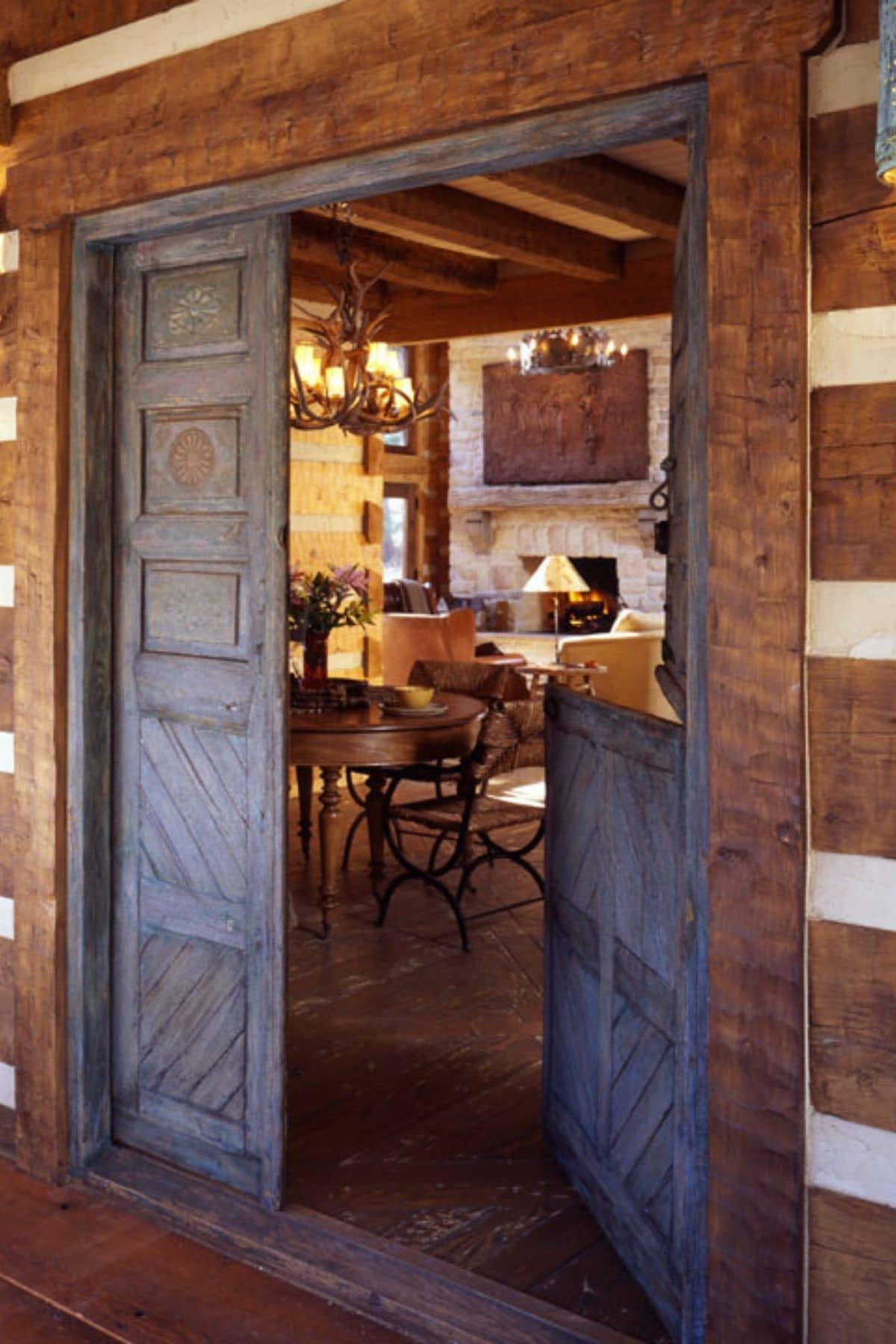 saloon style doors opening into log cabin