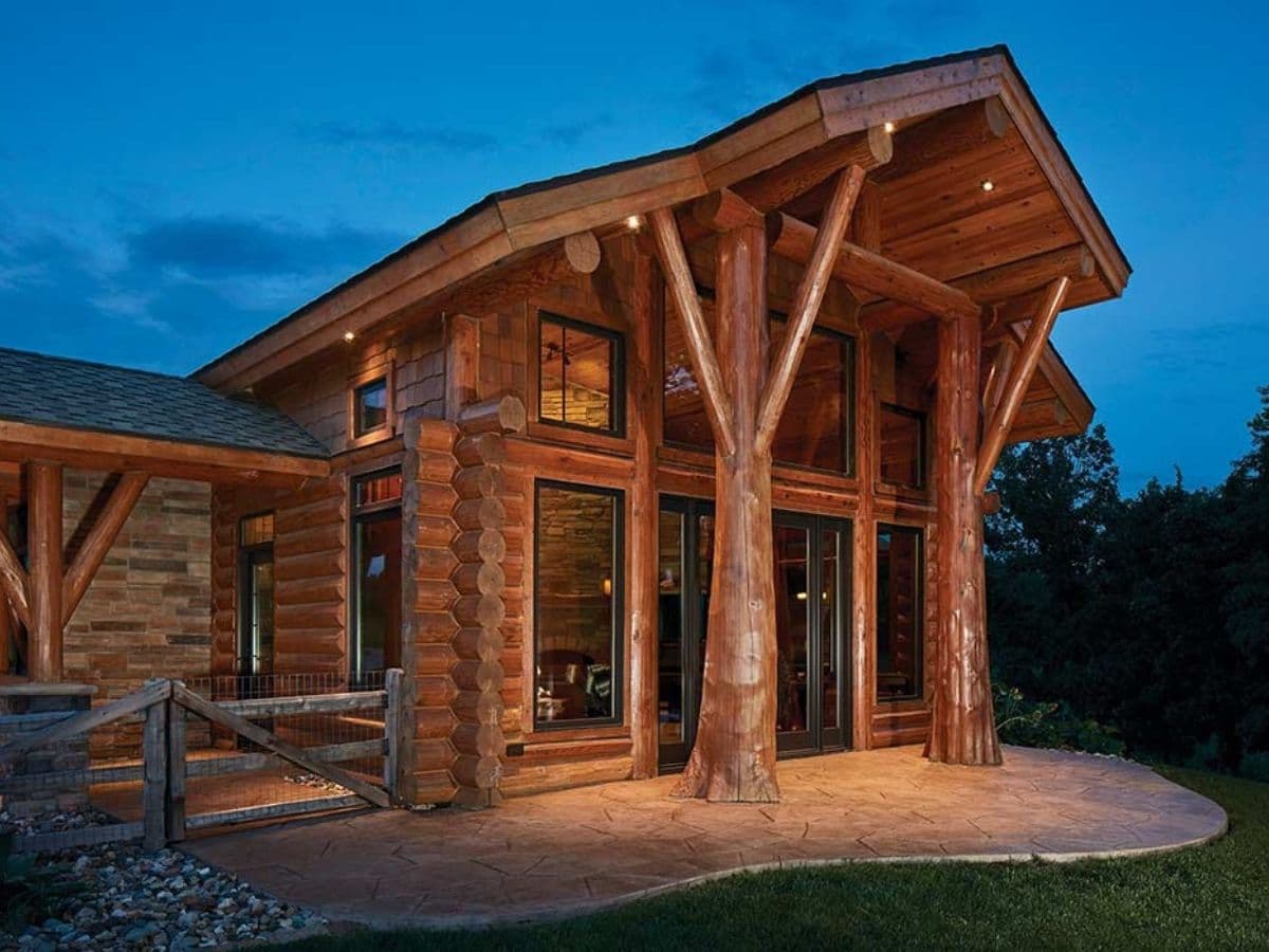 entry to log cabin with tall porch overhang
