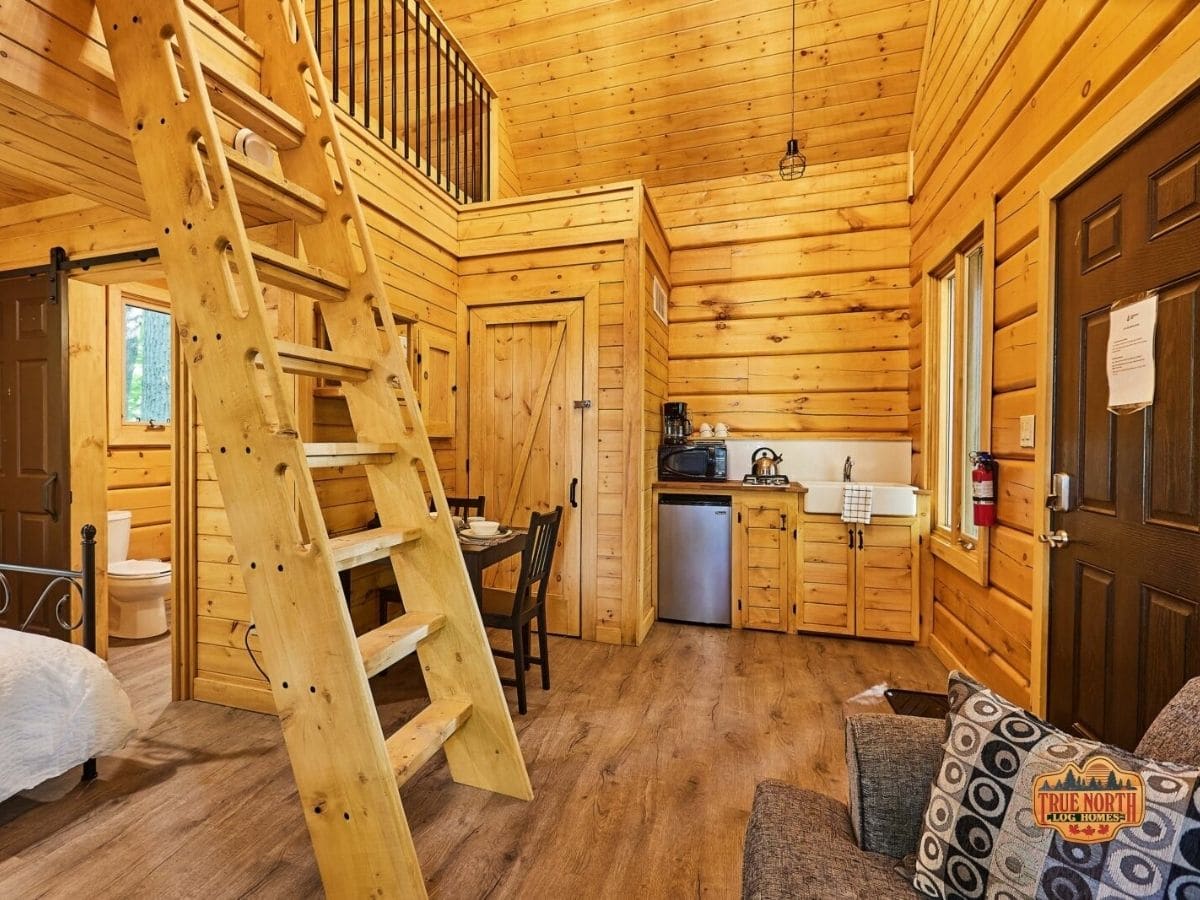 view into kitchenette with ladder on left of image