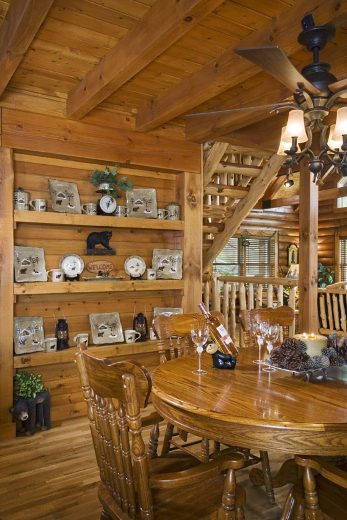 wooden dining table with wood hutch in background
