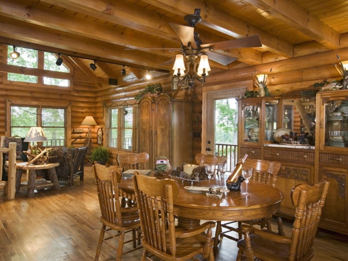 dining table in freground with rustic living room