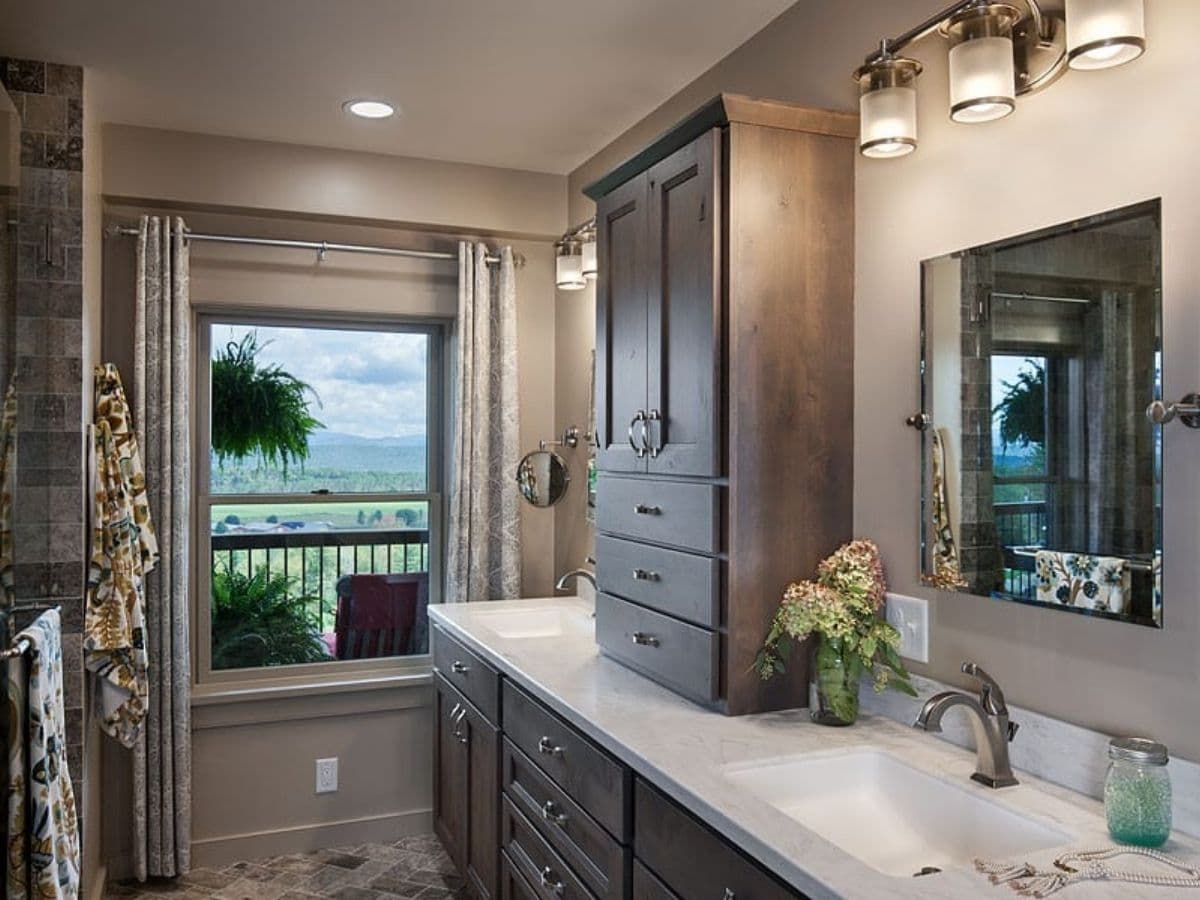 bathroom vanity with gray cabinets and light white countertop with deep sink