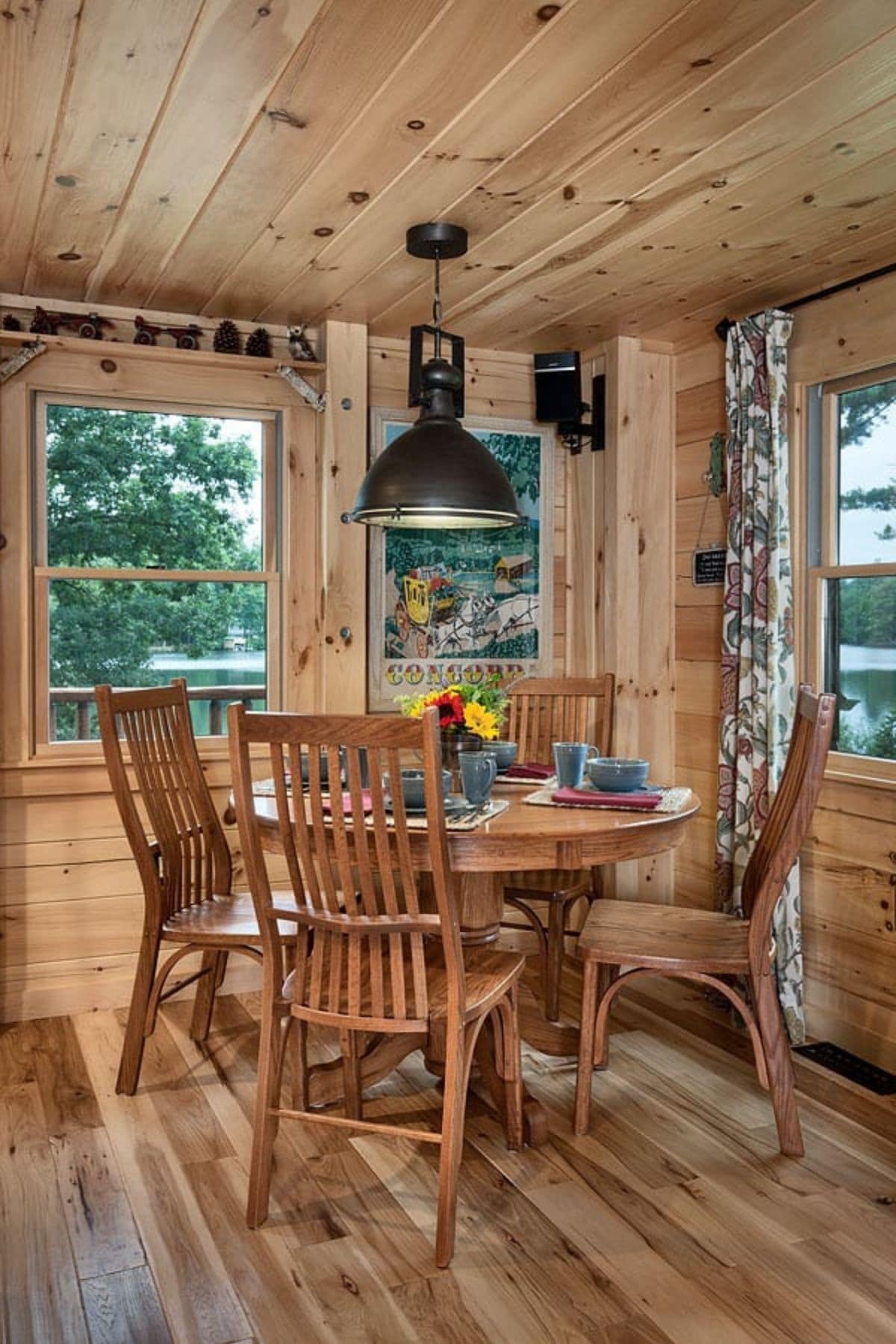 round dining table in corner nook of log cabin