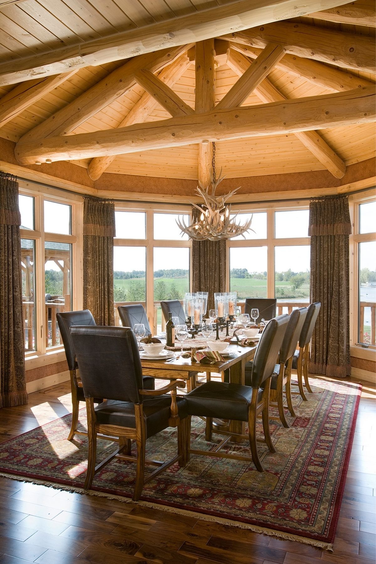 dining table in breakfast nook with windows on all sides