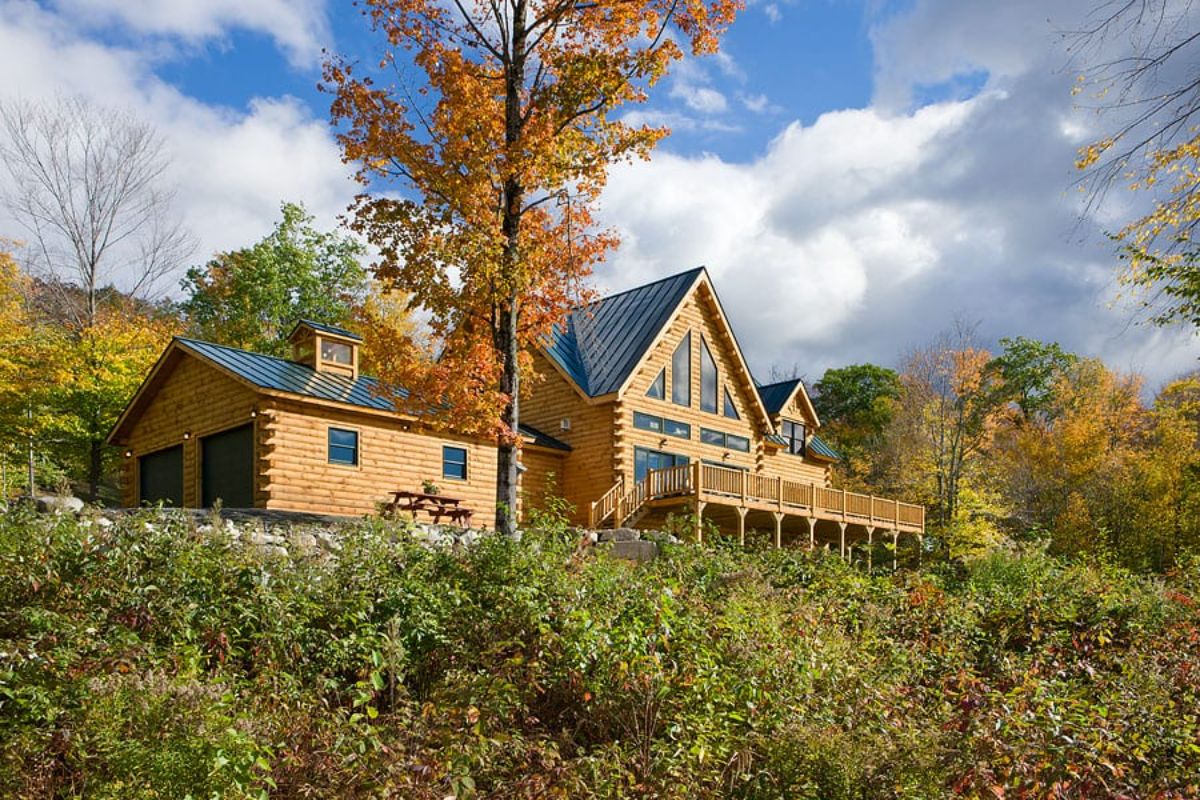 cabin on hill above grass