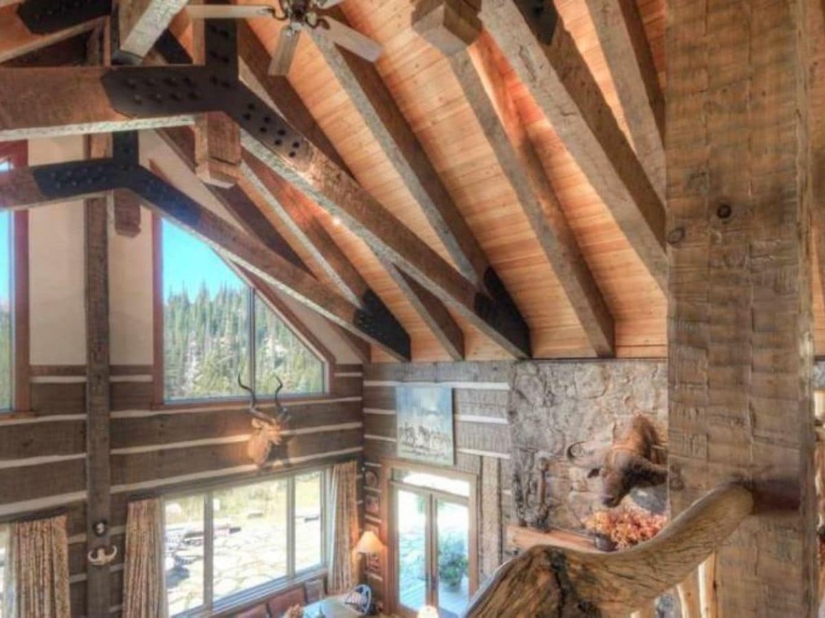 view of open log beams looking over main room