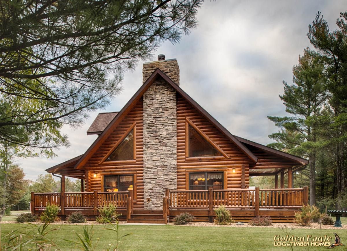 open porches on end of log cabin next to stone fireplace and large windows