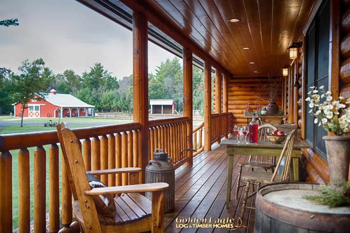 covered porch with wood Adirondack chairs