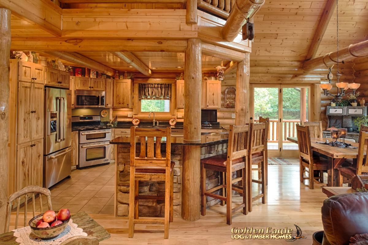 kitchen with wood and stone island on outside edge of kitchen