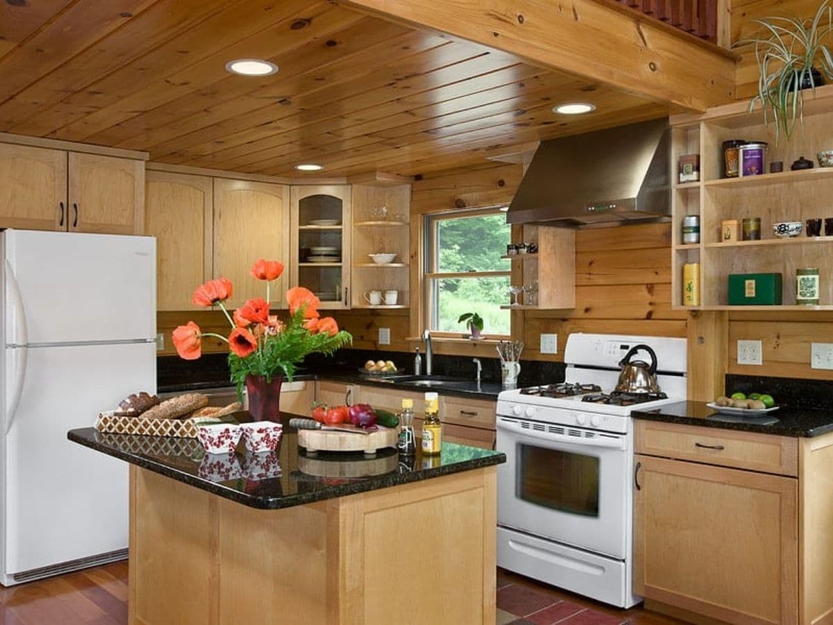 kitchen with white stove and wood cabinets