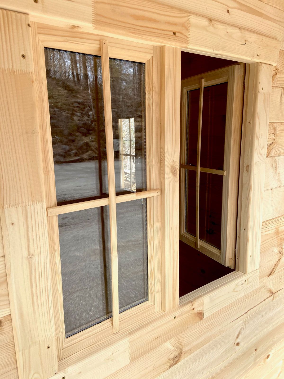 window opening inward in small cabin