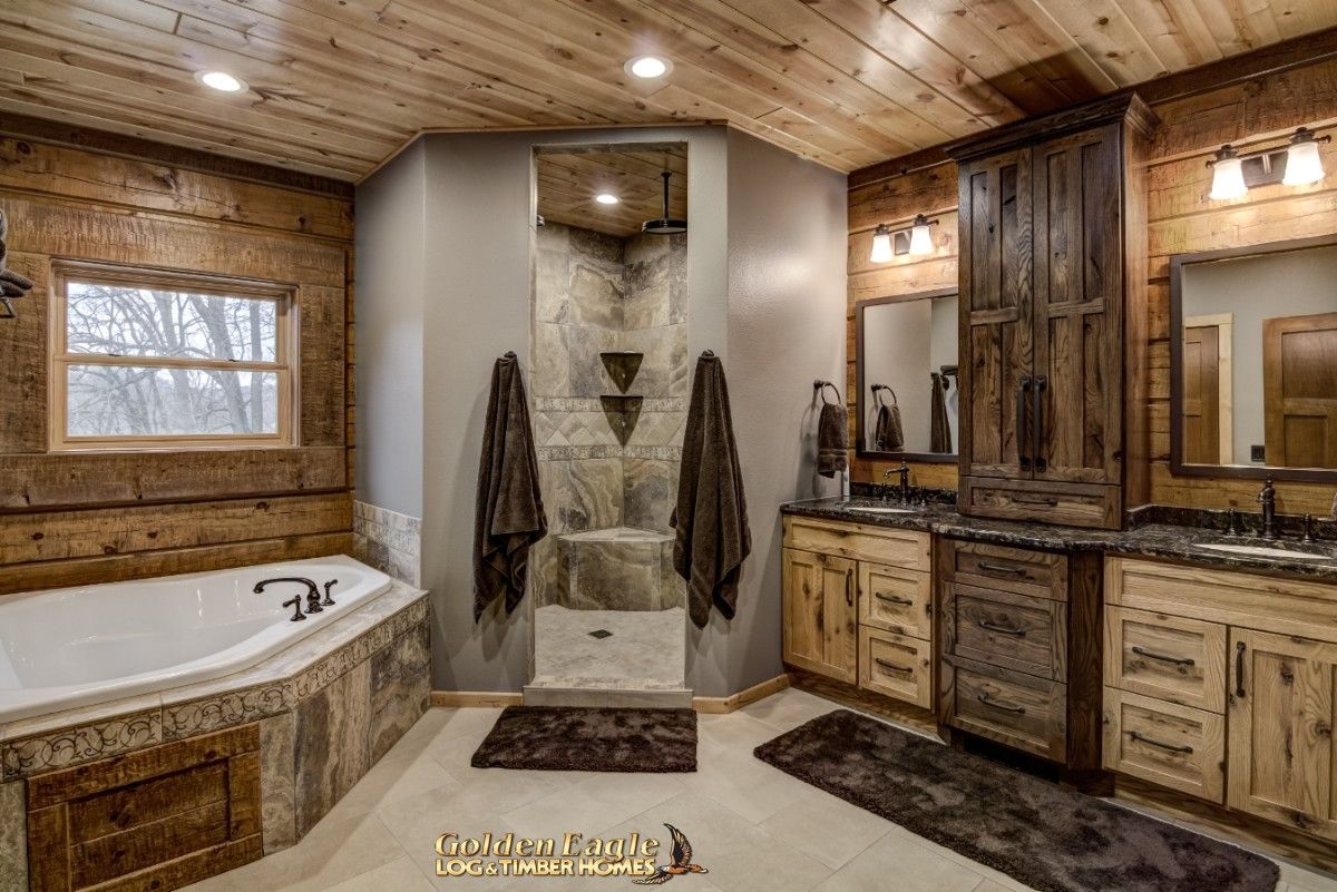 towels on either side of shower door in master bathroom with gray walls