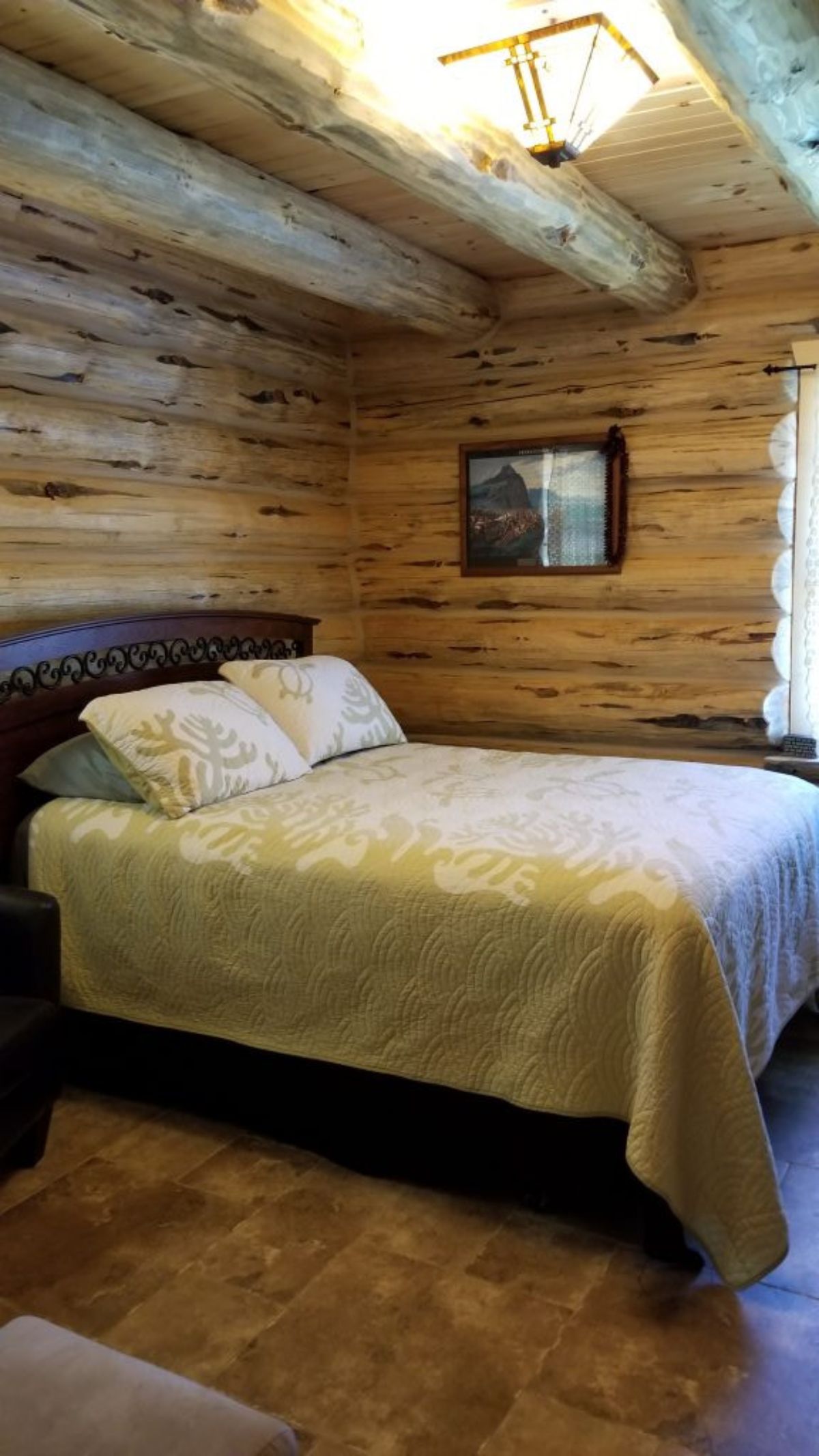 bed with dark wood bedframe and white blankets