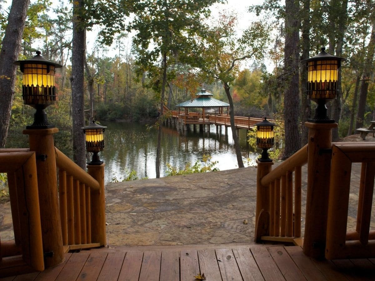 view of lake and gazebo on dock from porch