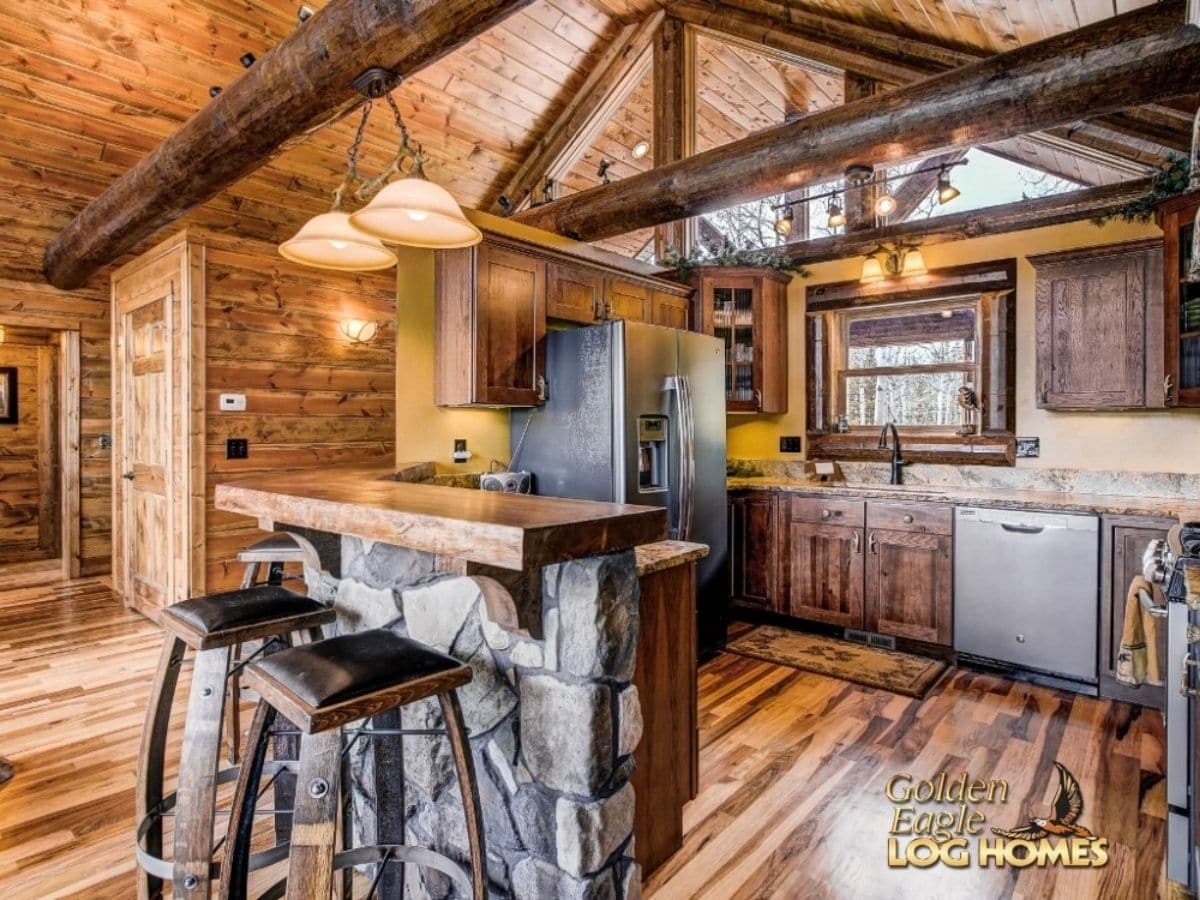 kitchen with small stonework bar in foreground