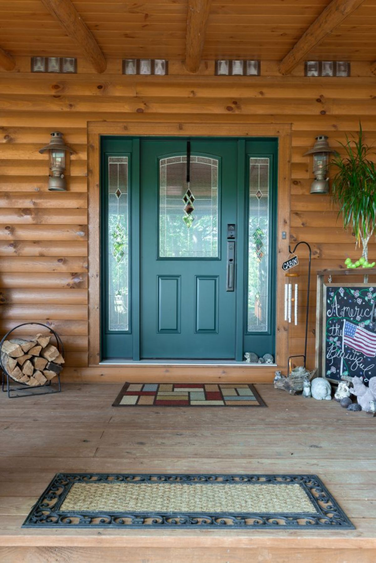 green front door on log cabin