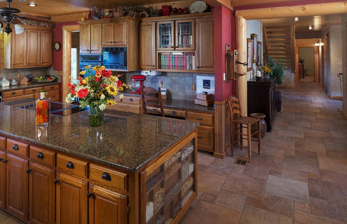 modern kitchen with wood island and granite countertop