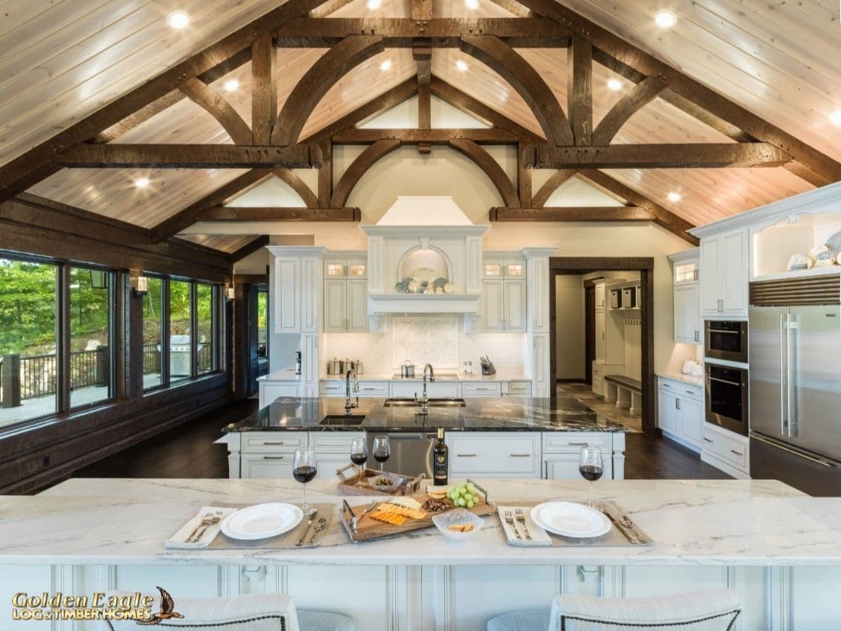 kitchen island bar in front of large island with marble tops