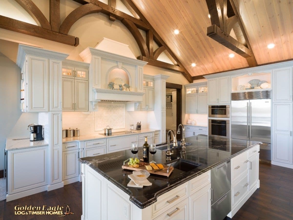 black countertop on kitchen island above white cabinets