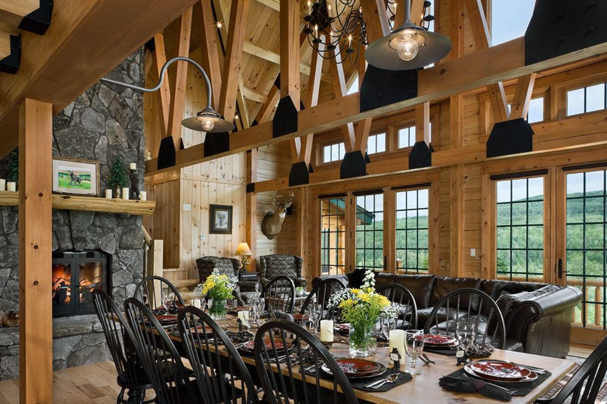 view of living space behind dining table with black chairs