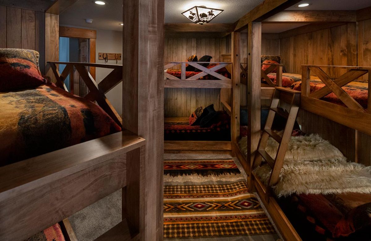 rustic wood bunk beds in bedroom with 6 beds