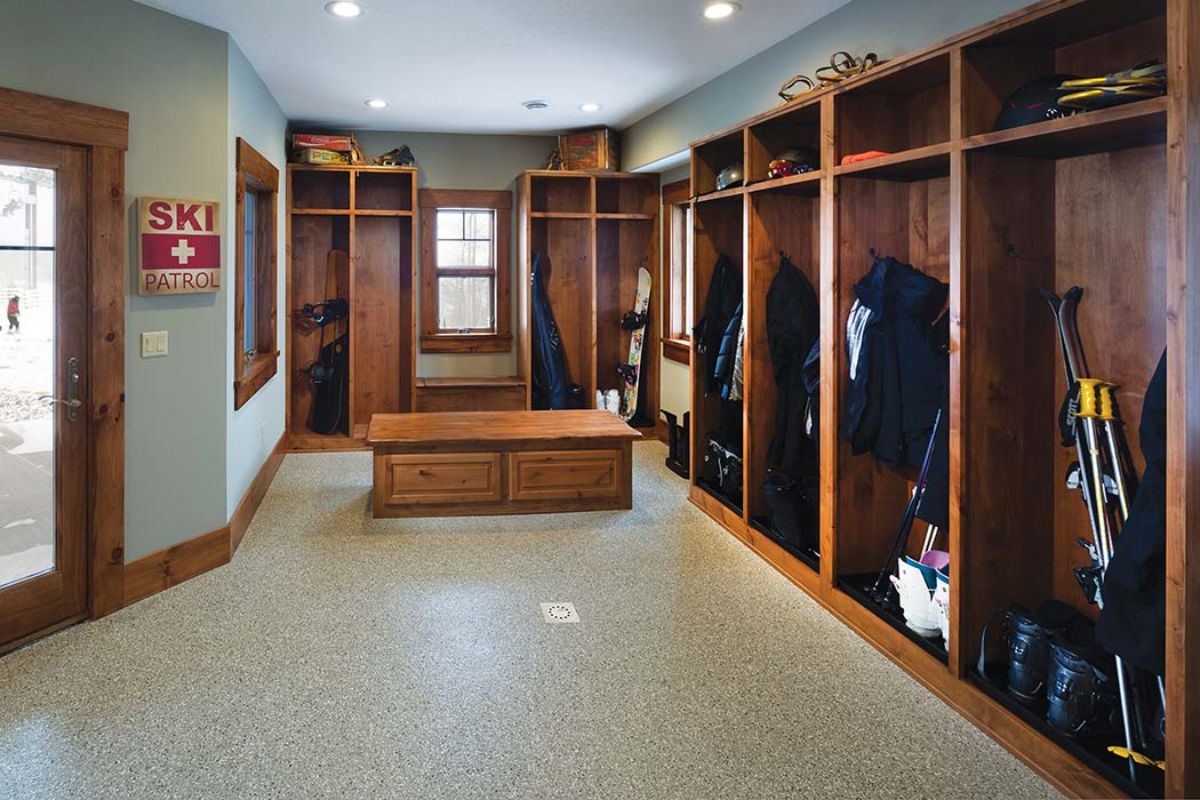 walk in closet in basement with open shelves and closet rods