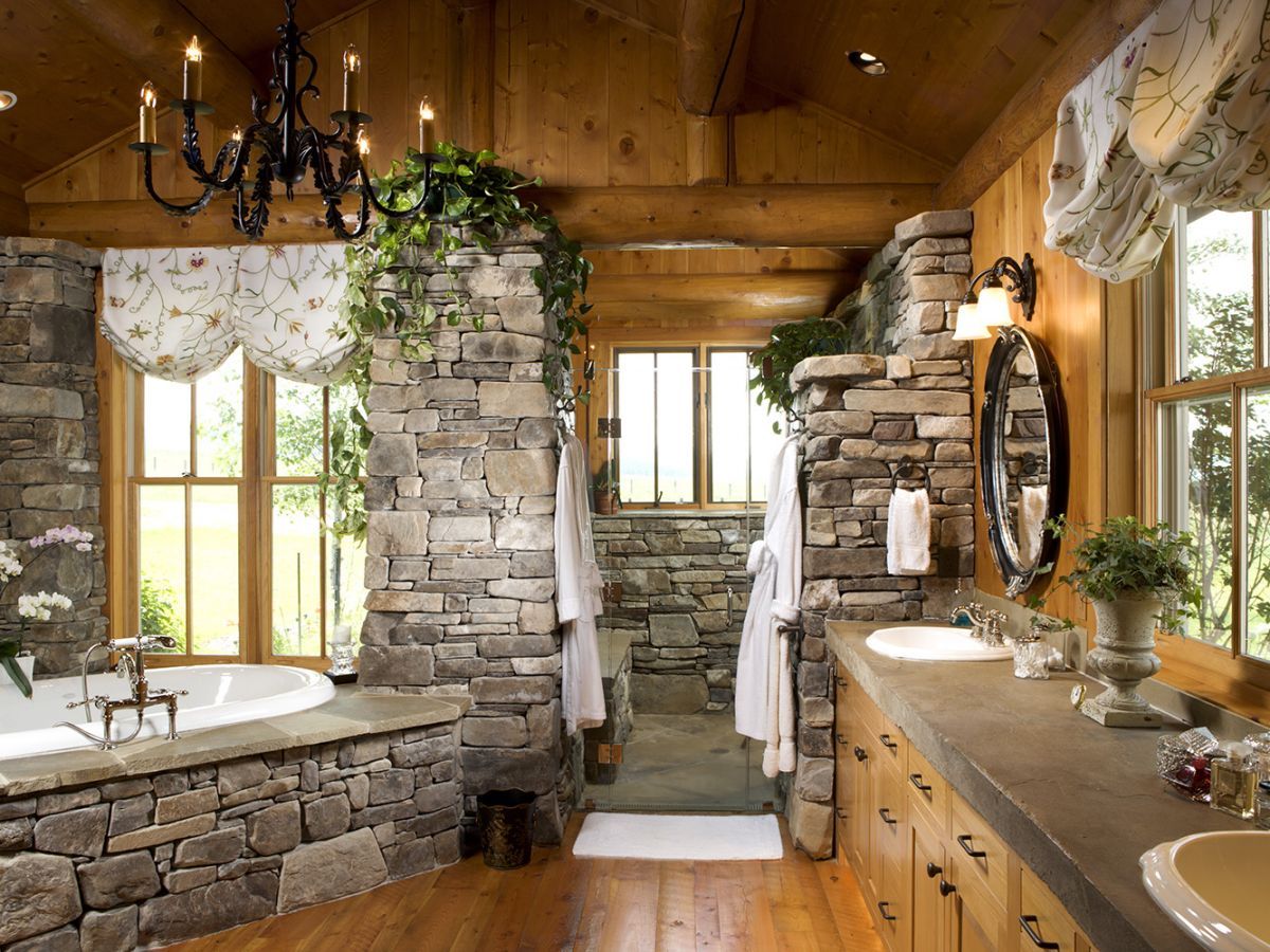 stone surround by white soaking tub with vanity against right wall