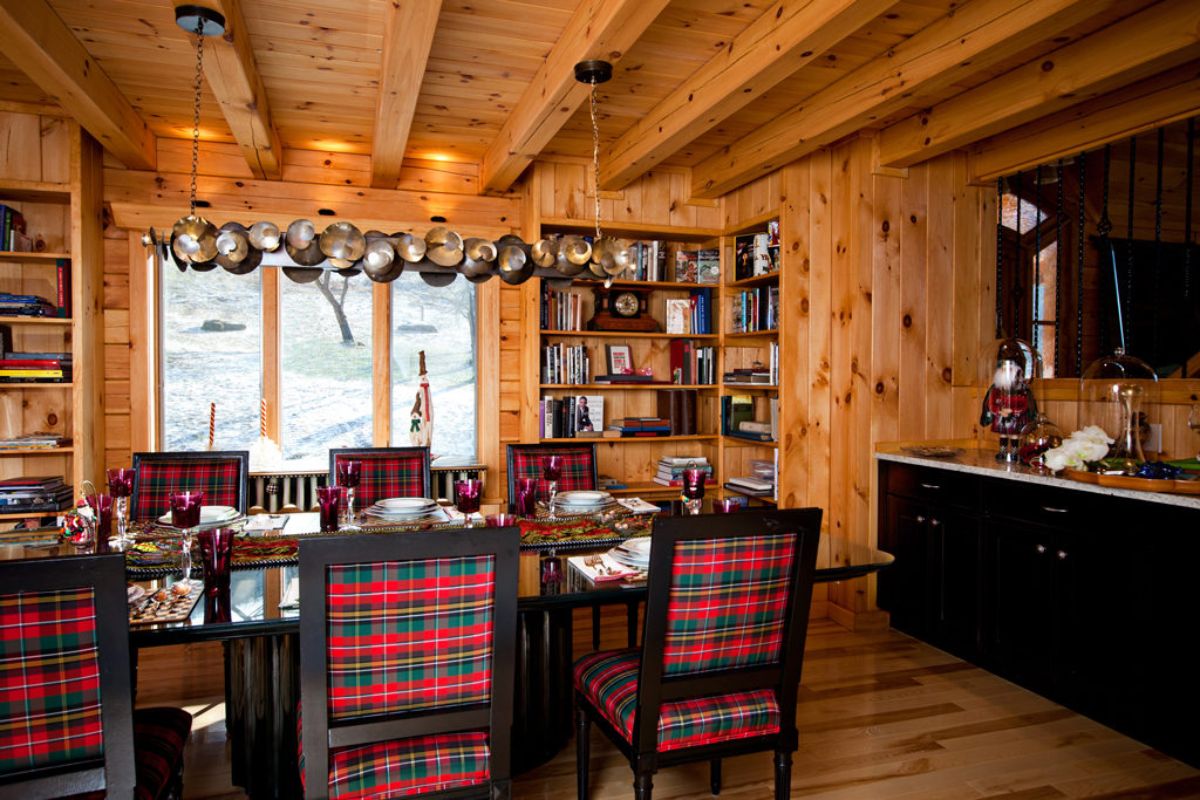 red plaid upholstery on kitchen chairs around dark wood table