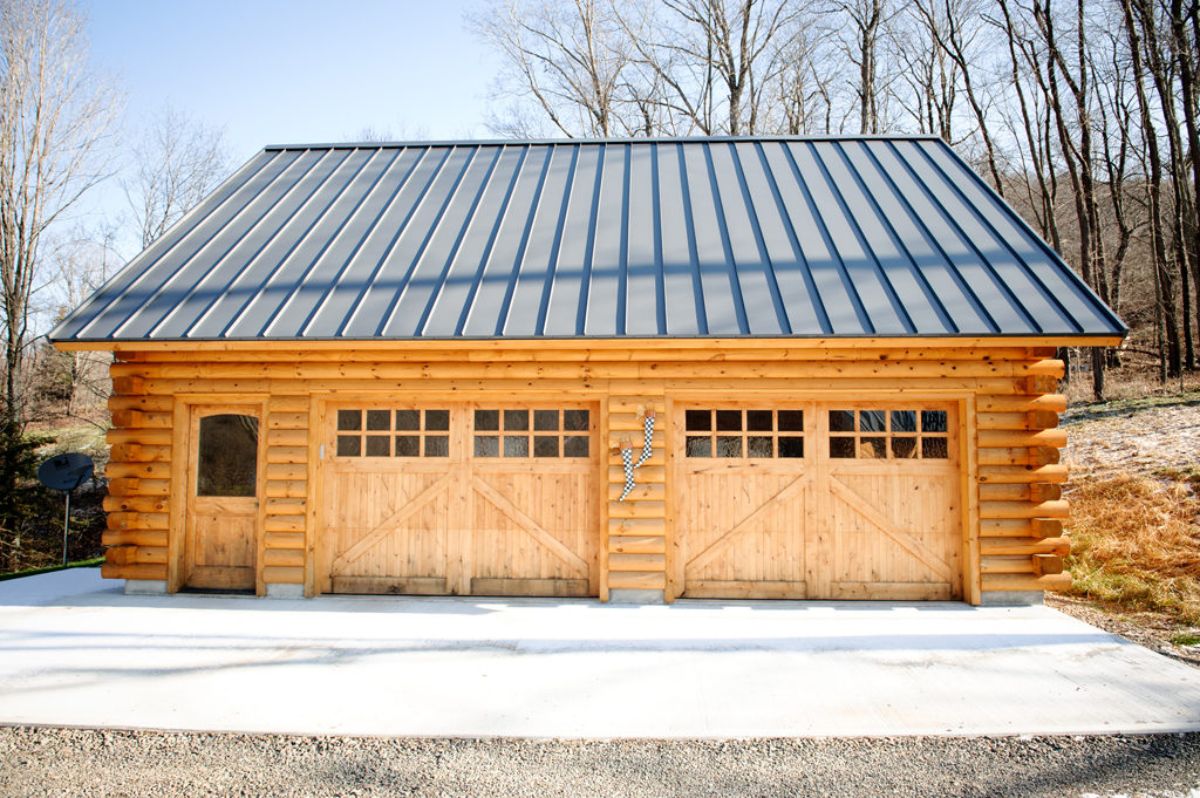 front of two car garage with door on far left side for entry