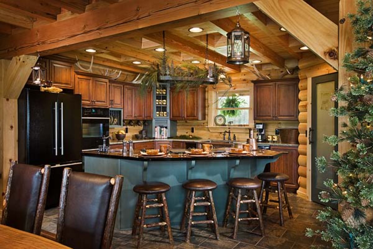 slate gray surround on bar in kitchen with dark countertops and wooden stools around bar