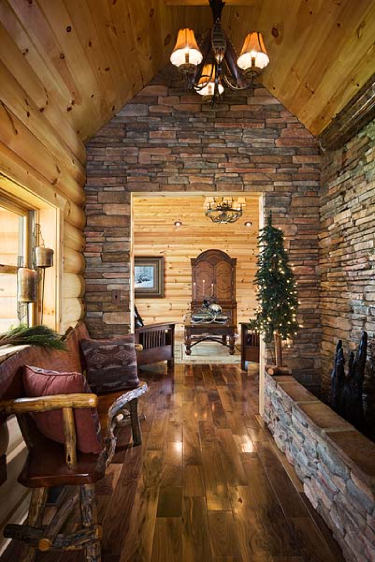 stone archway and entry with red cushion on wooden chair on left of entry