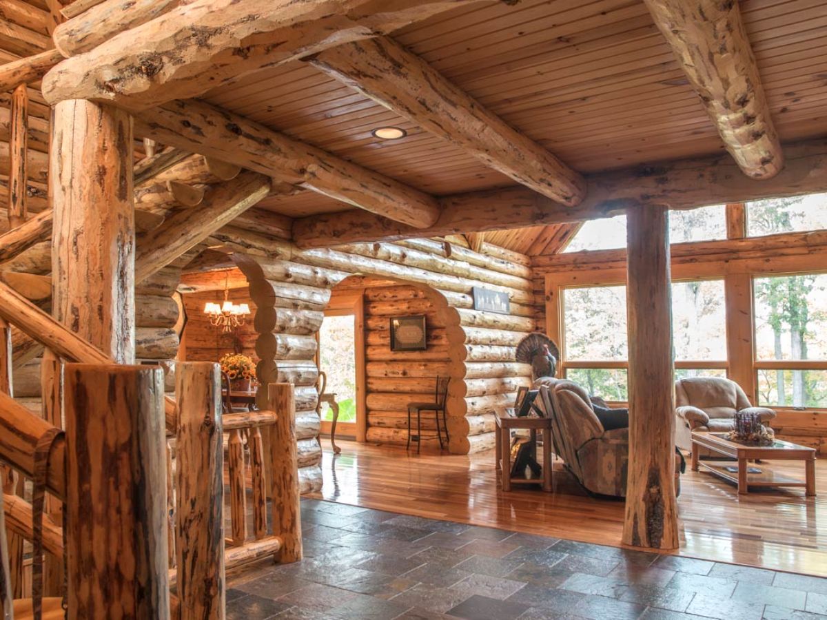 log cabin with archways between rooms