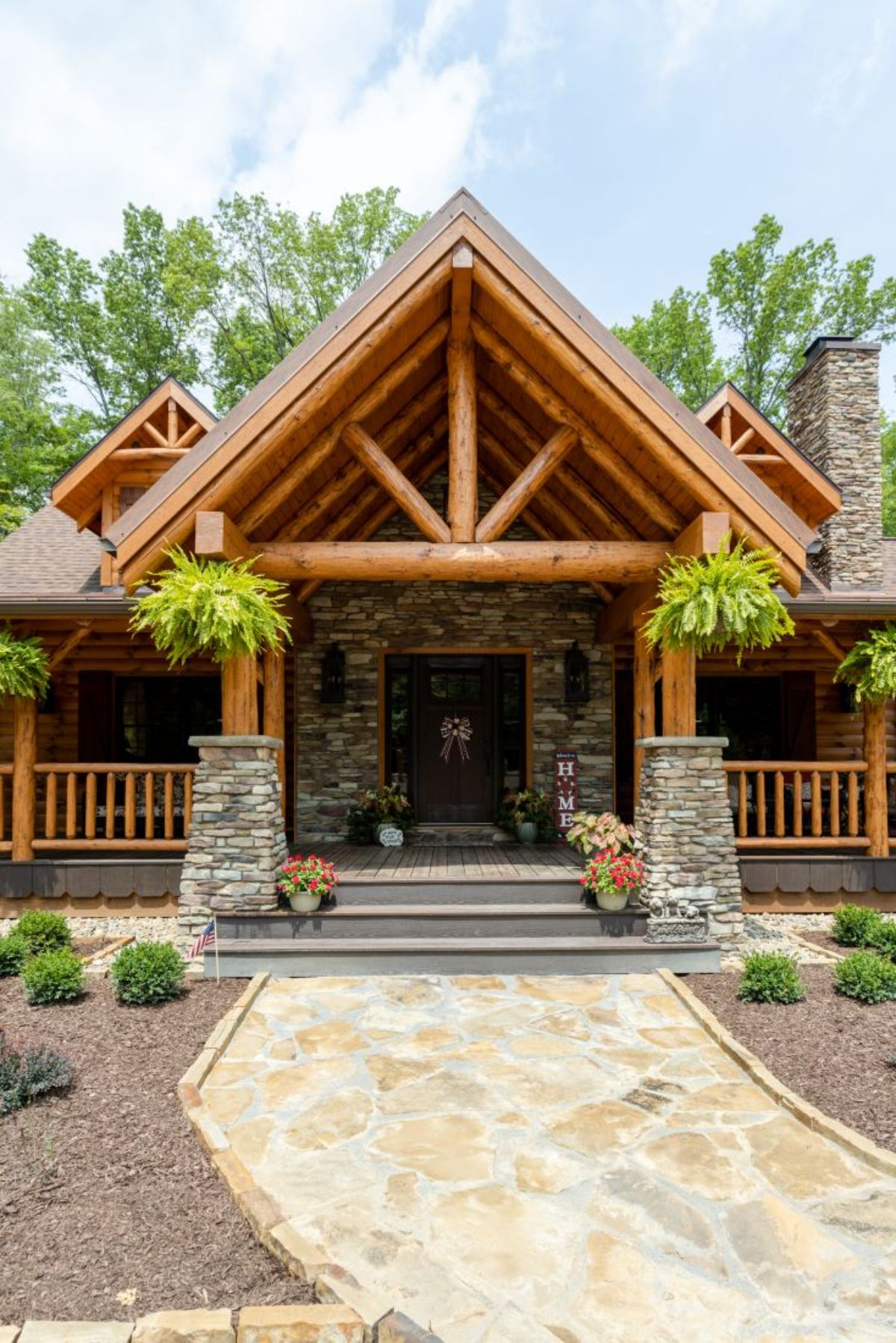 log cabin entrance with rock columns