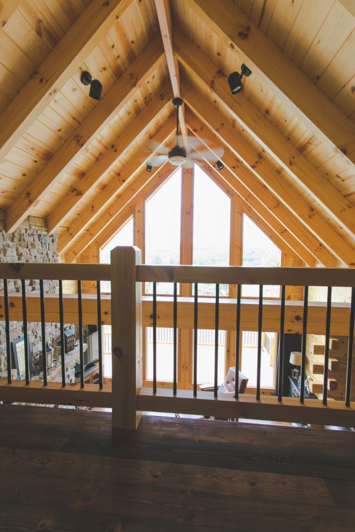 railing on loft looking over the great room of log cabin