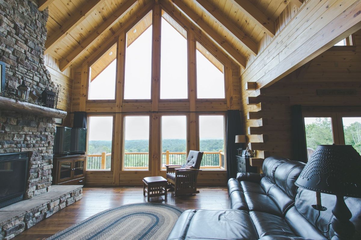 great room with wall of windows in background and sofa in foreground