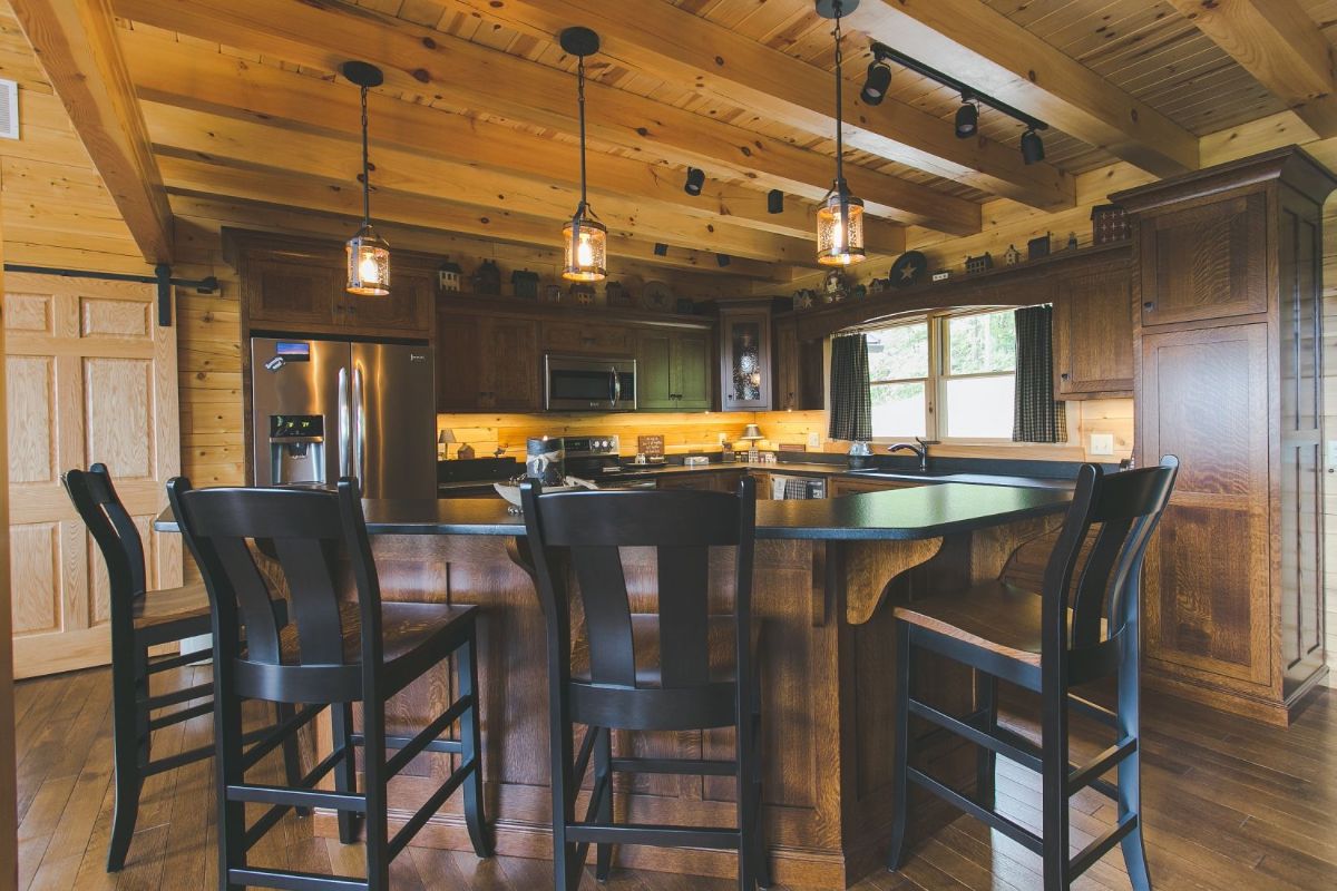 black chairs around bar in kitchen