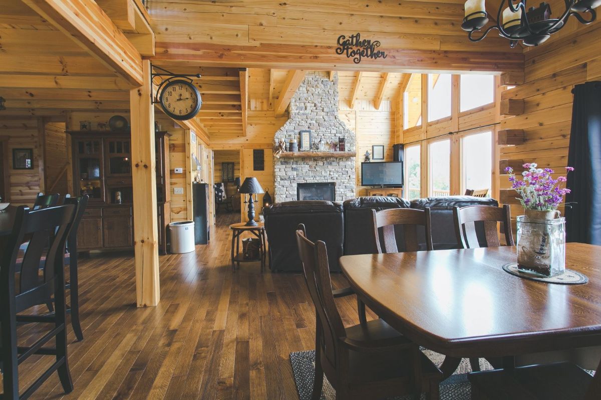 table in foreground with stone fireplace