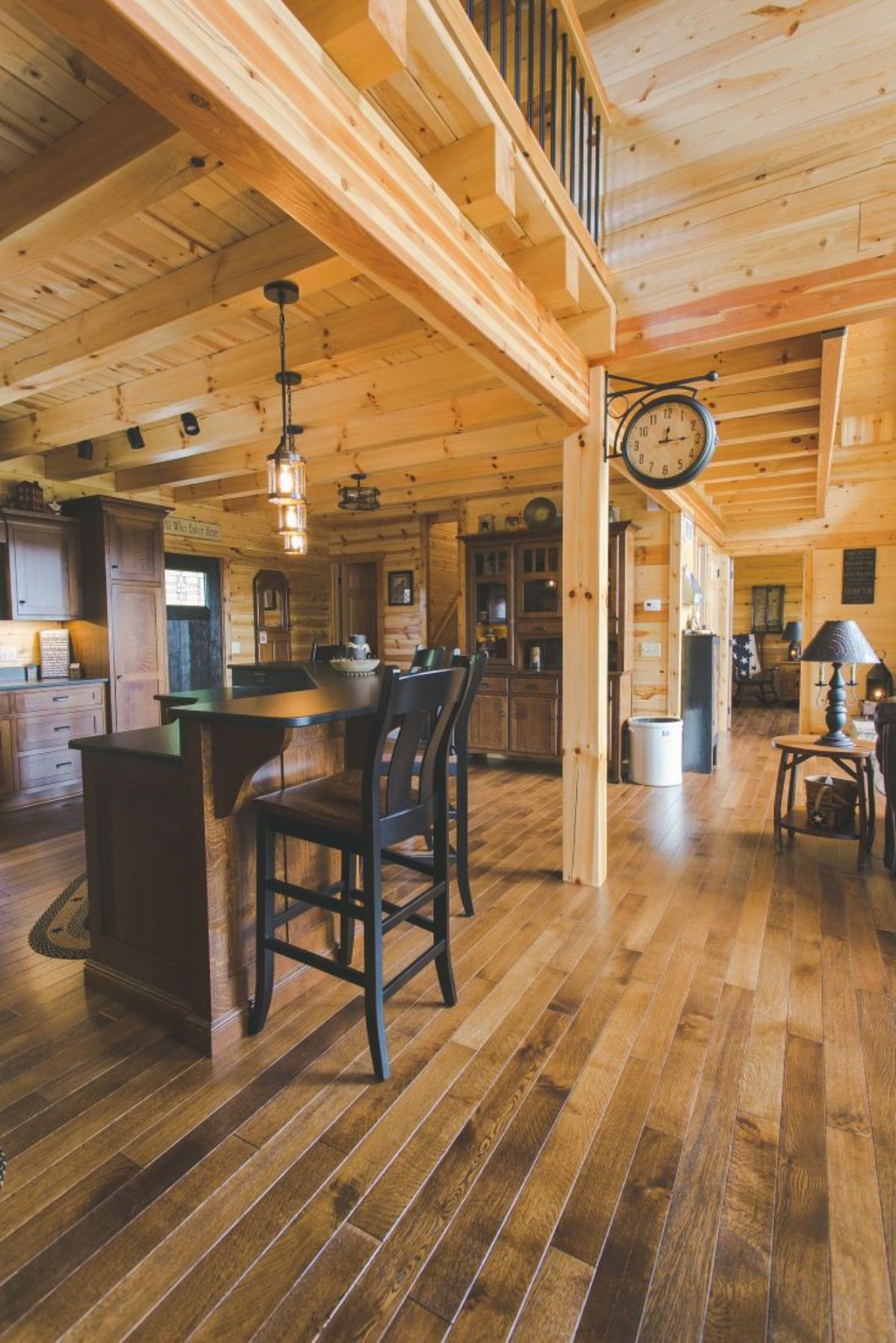 viw of bar in kitchen with dark wood cabinets in background