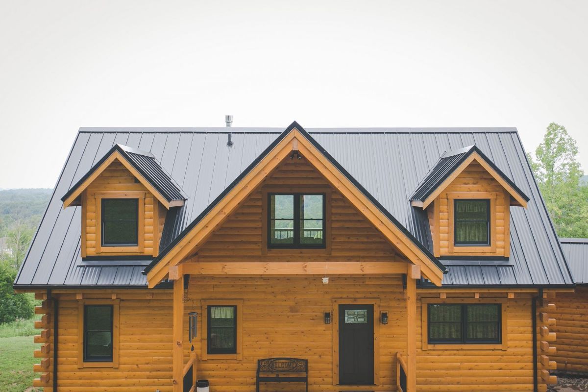 front of log cabin with covered front door