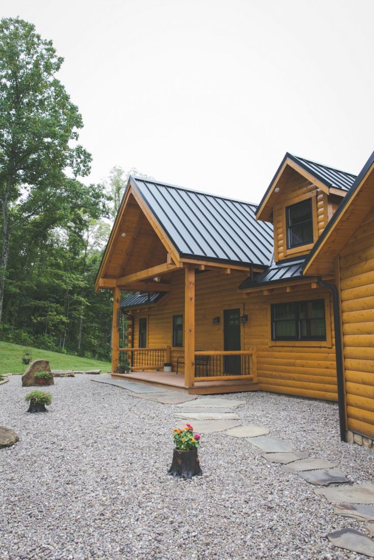 front door and stone walkway to log cabin