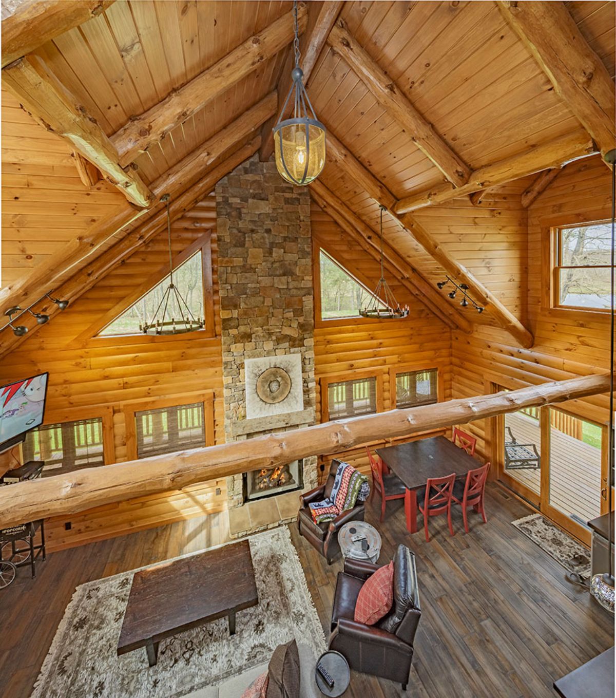 view down into living room of log cabin