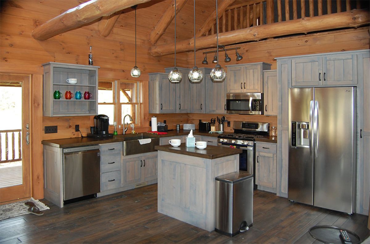 light gray cabinets with stainless steel appliances in kitchen