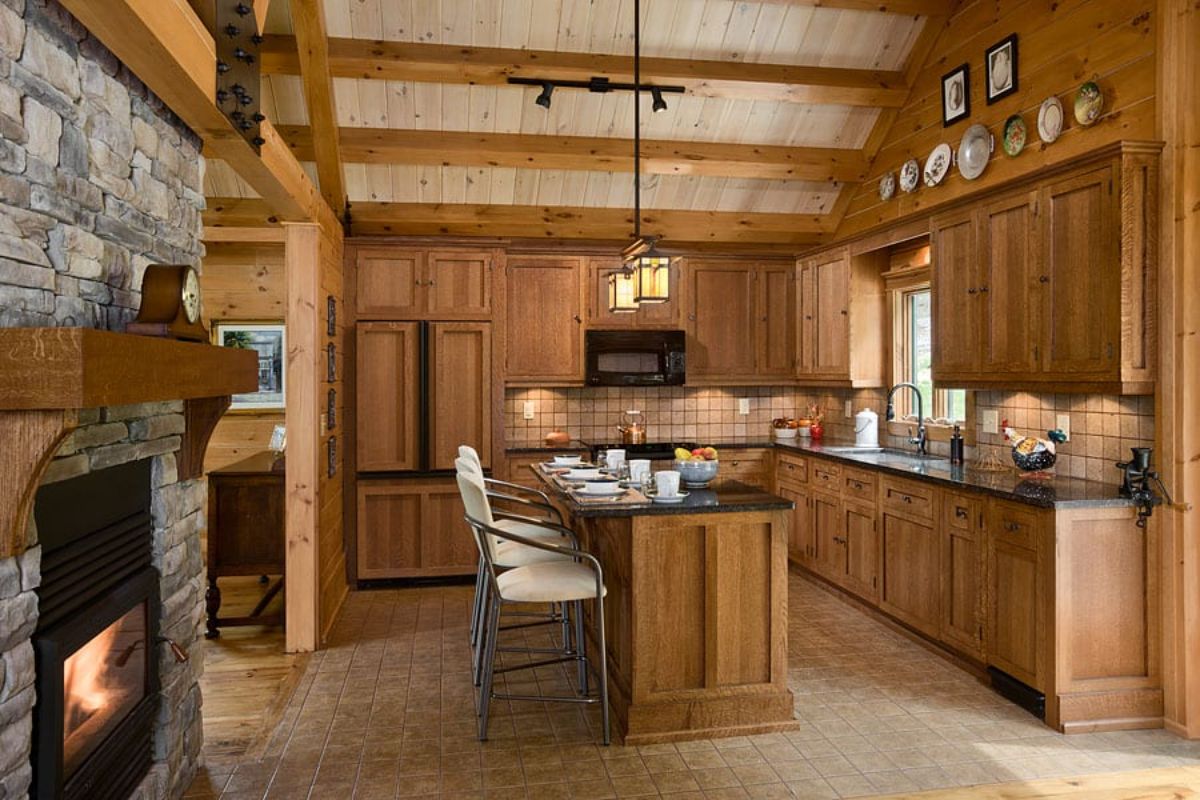 island bar in middle of kitchen with white and gray stools at counter