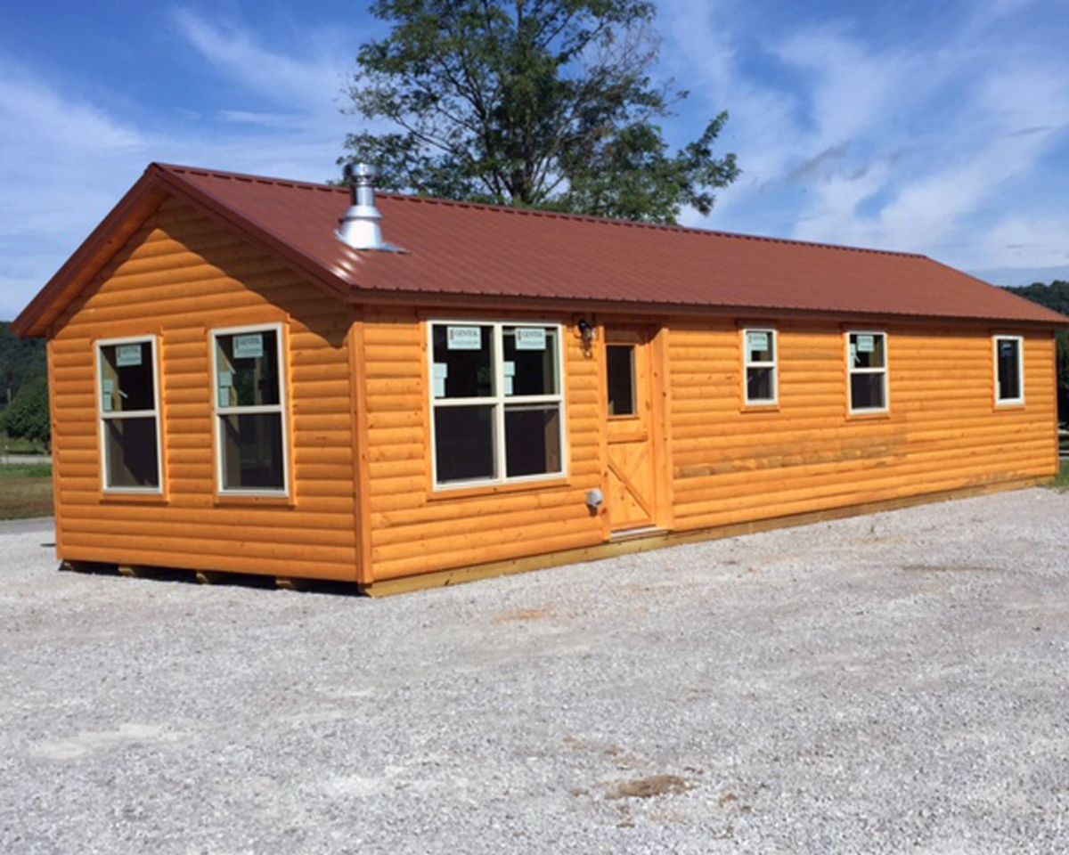 log cabin with maroon roof