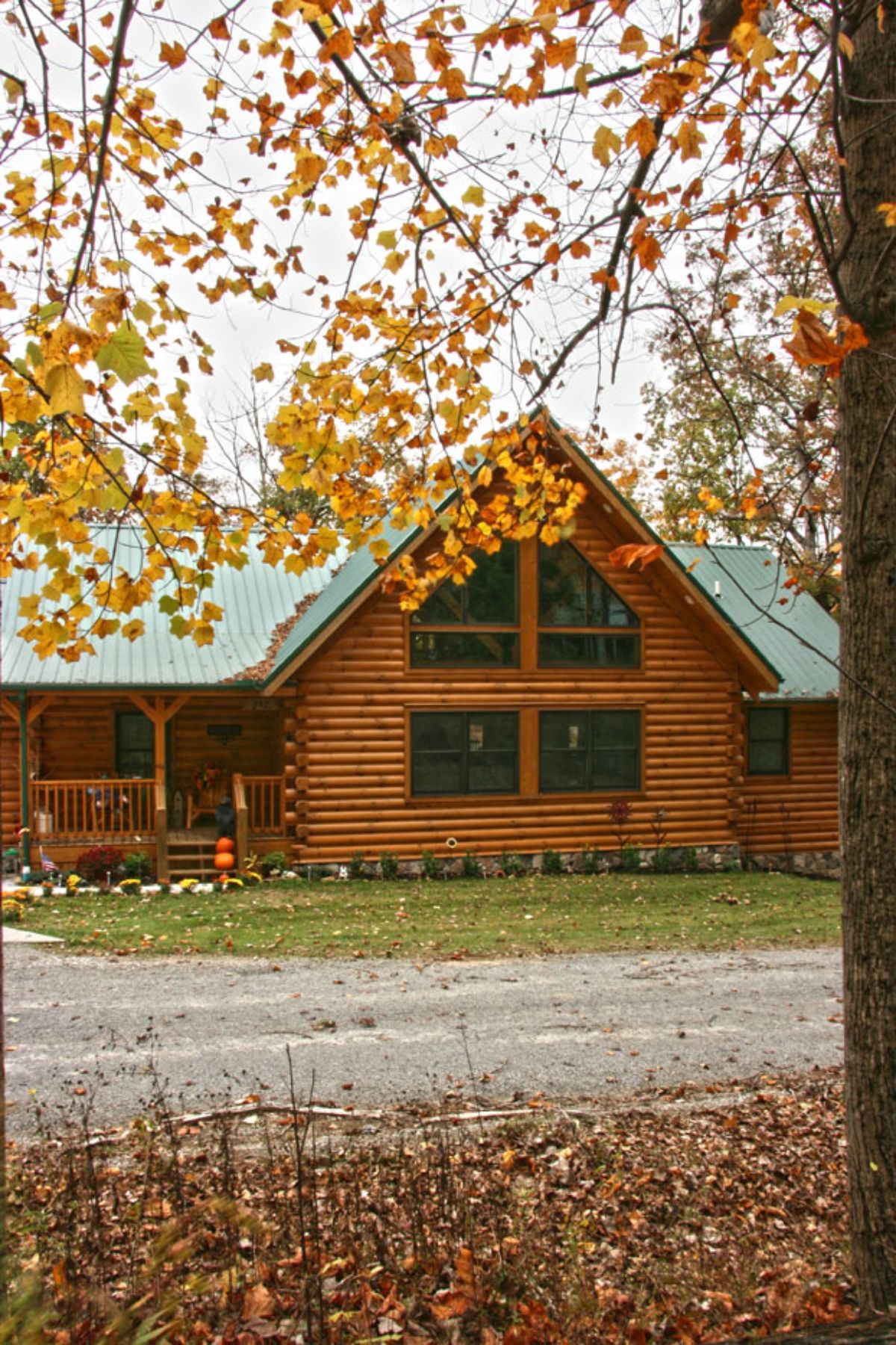 front porch and open windows on log cabin