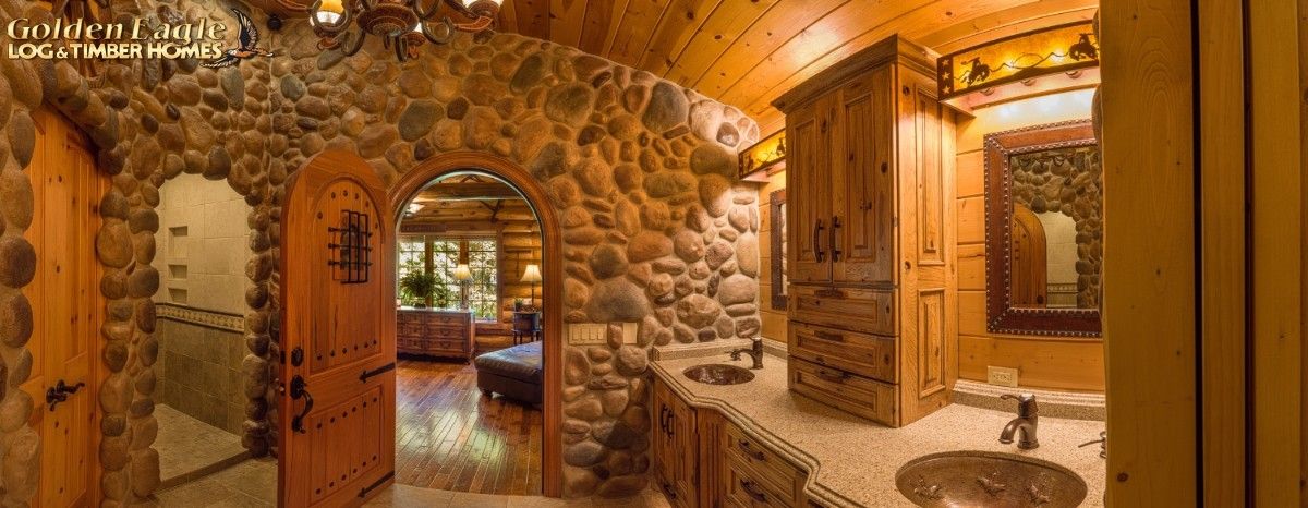 wood arched doorways in stone wall of log cabin basement
