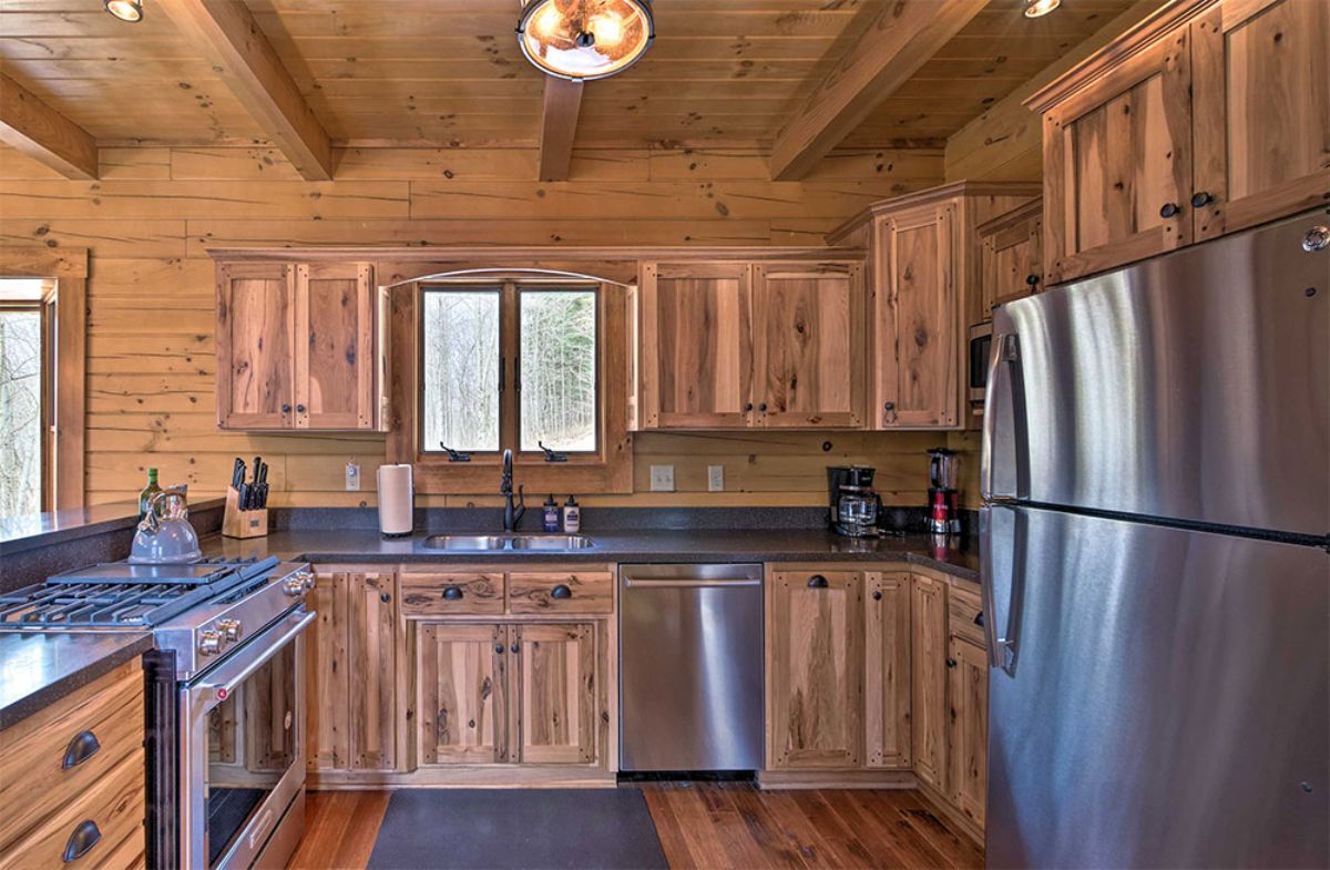 stainless steel appliances in kitchen with wood cabinets