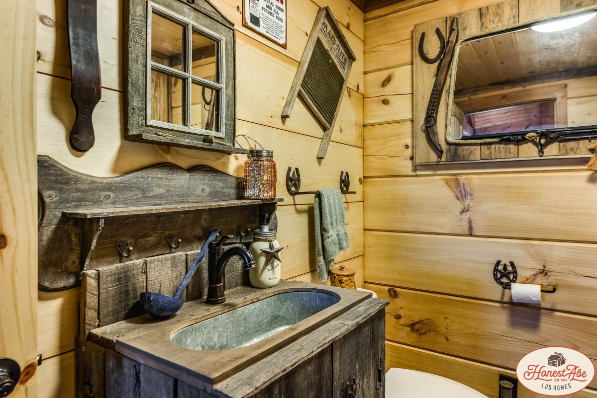 bathroom with galvanized tub sink in wood vanity
