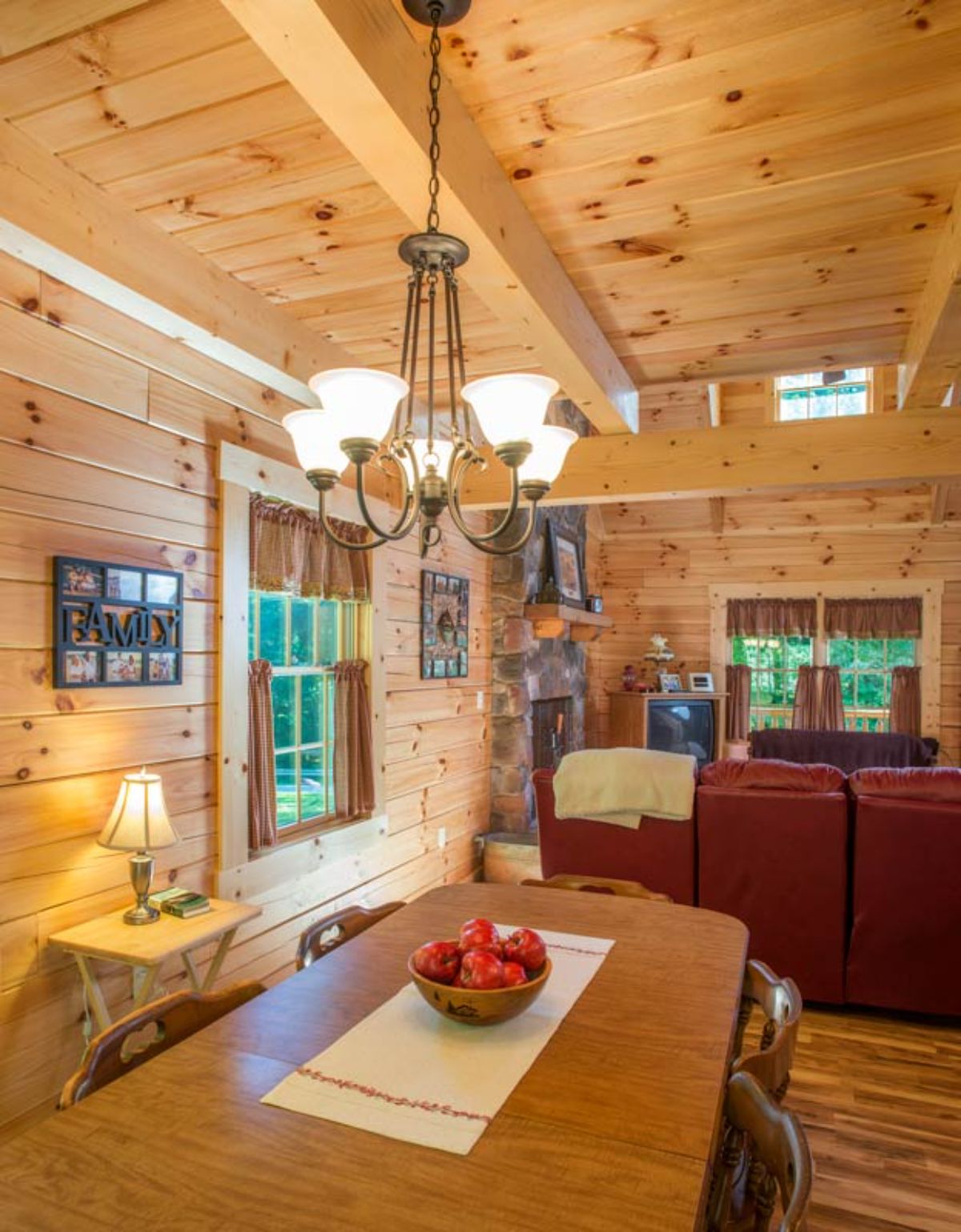 window between living room and dining room in log cabin